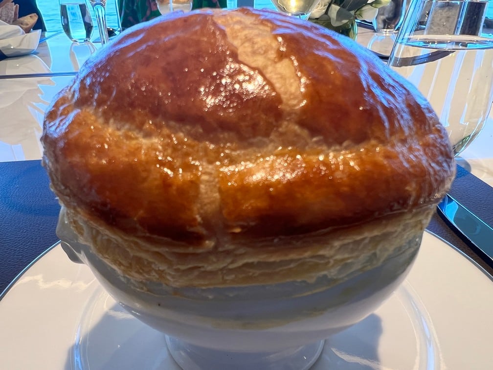Homage to Chef Paul Bocuse Foie Gras and Truffle Soup en Croute - Photo by Goldring Travel