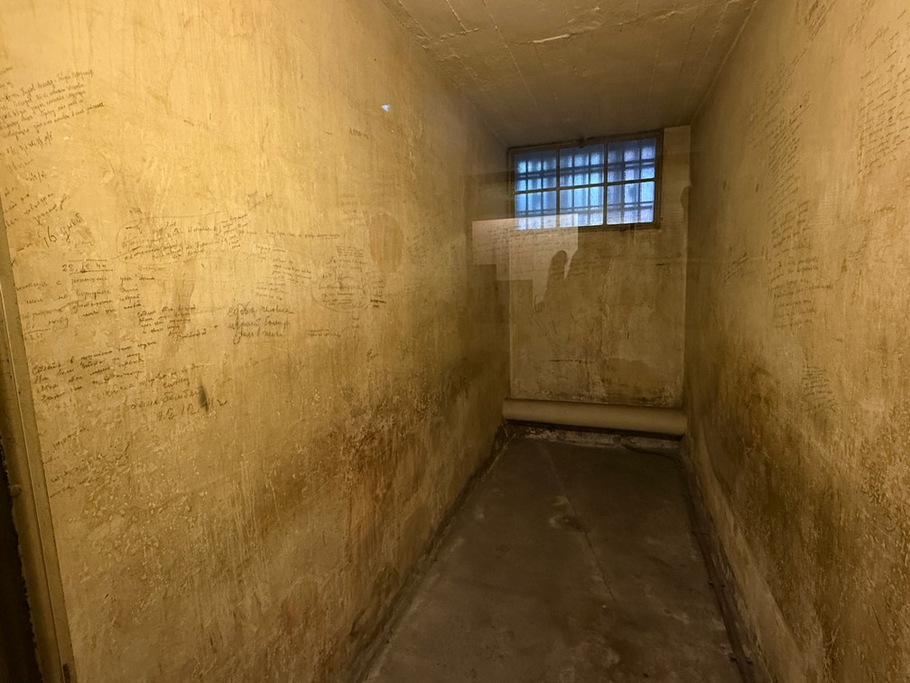 A small Gestapo prison cell held up to 30 Jews, it's wall filled with prisoner's writings