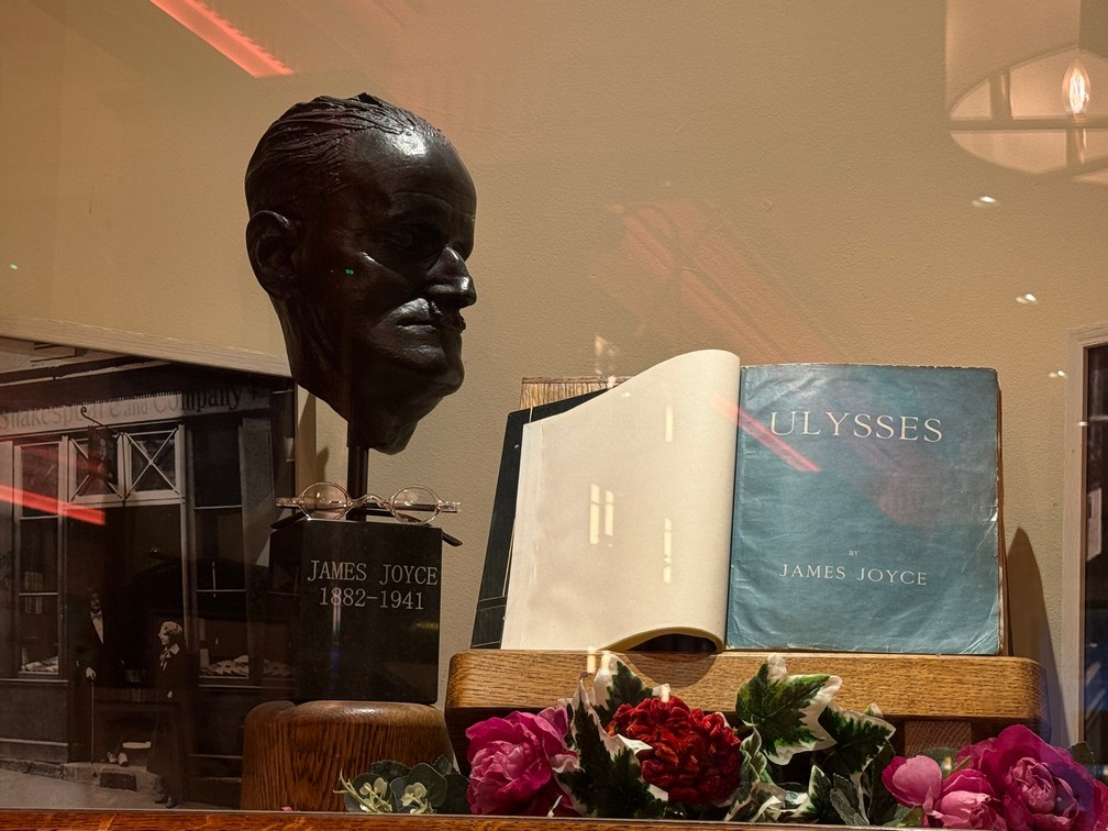 A bust of James Joyce with an "original" copy of The Odessey. 